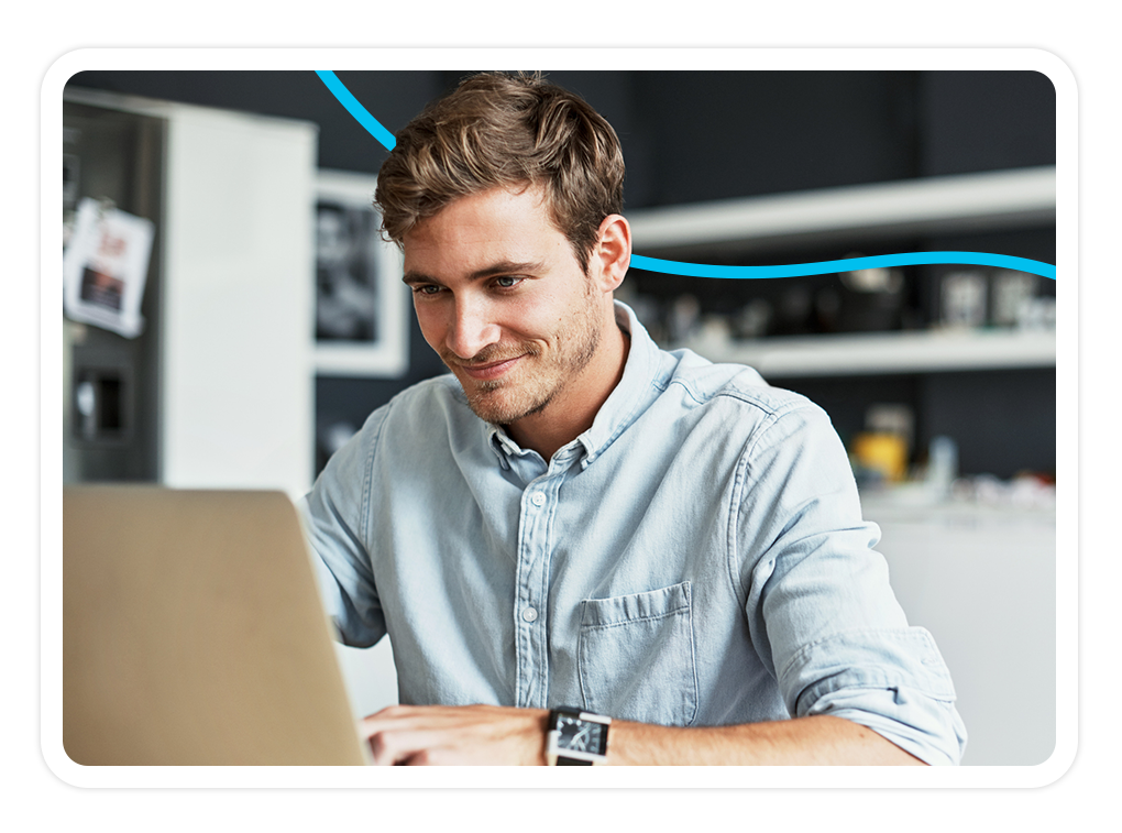Image of a student sitting in front of a laptop computer