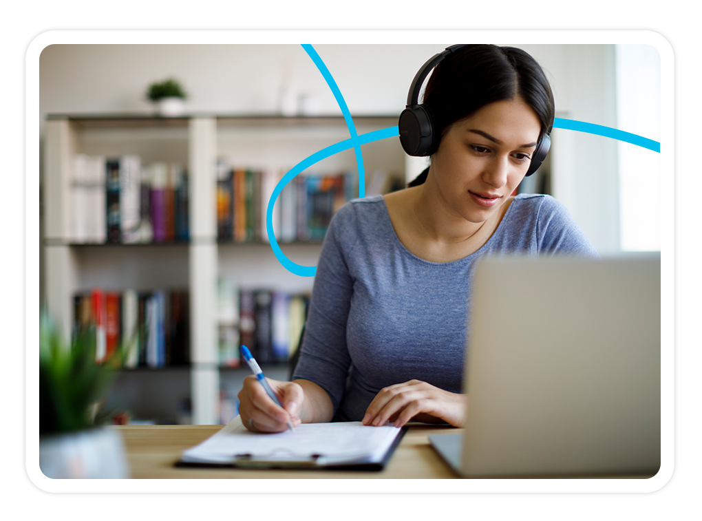 Image of a woman sitting at a laptop computer